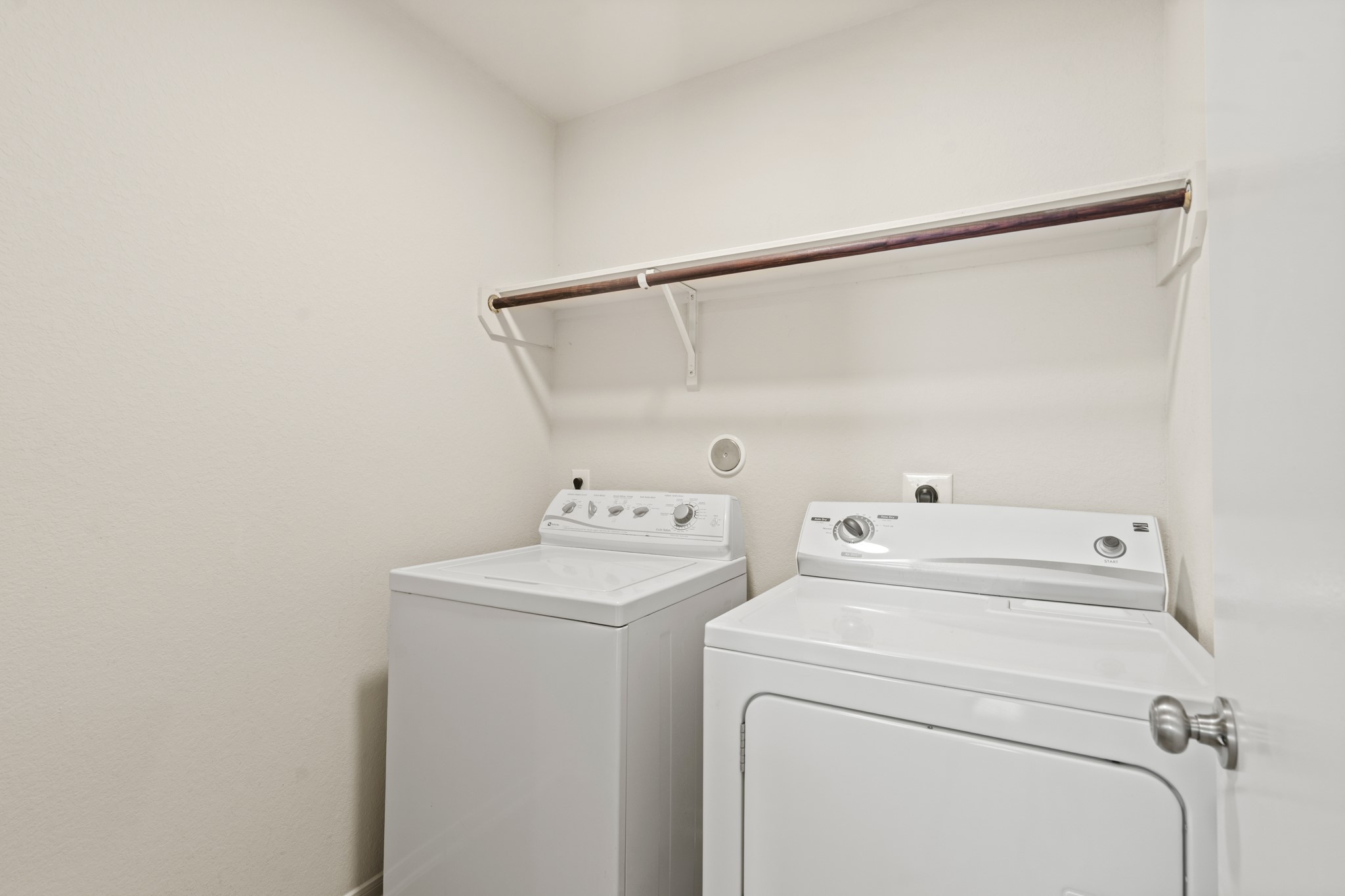 3118 Winchester Rnch Trail Katy, TX 77493 - Photo 20 of 22 The conveniently located laundry room comes complete with a full-size washer and dryer, a built-in shelf and hanging rod overhead for added storage, and easy access — making laundry day simple and efficient for the whole family.