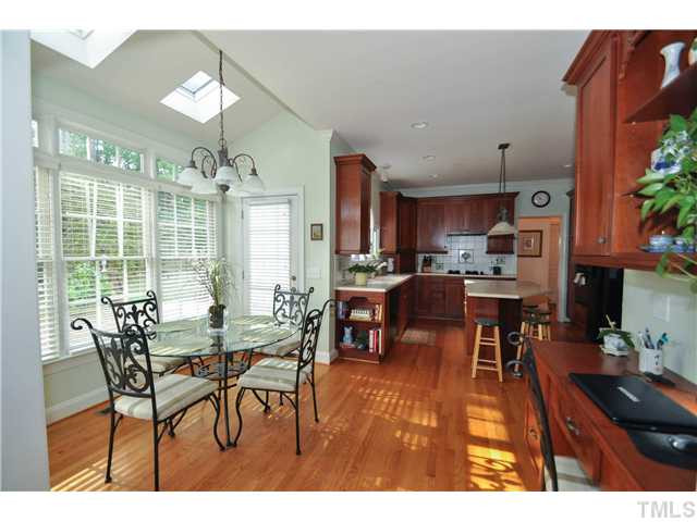 1805 Liatris Lane Raleigh, NC 27613 - Photo 12 of 25 Light and bright breakfast nook with access to the wonderful back deck. Enjoy all the natural lighting with the whole wall of windows and sky lights! Breakfast Area