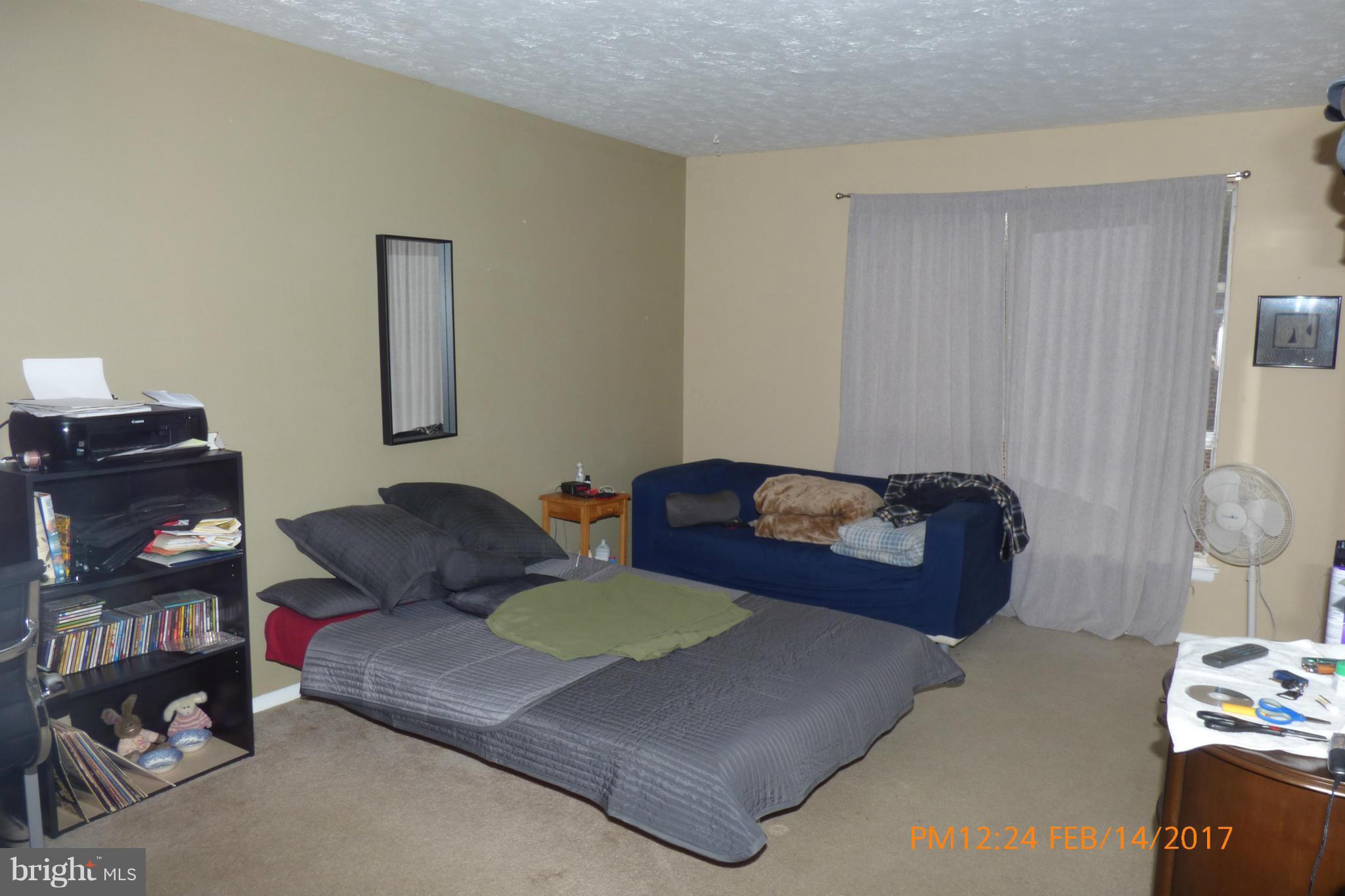 3940 Bel Pre Road, Unit 7 Silver Spring, MD 20906 - Photo 11 of 17 a living room with furniture and wooden floor
