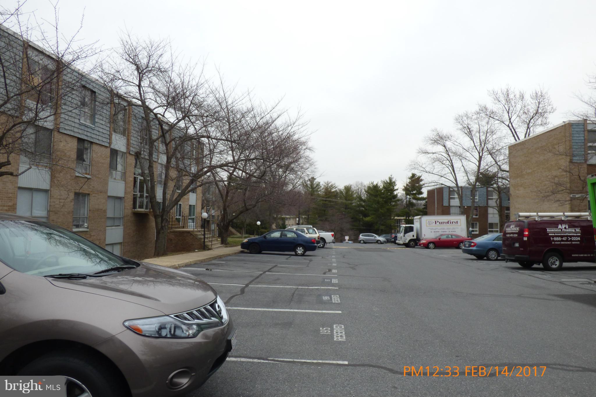 3940 Bel Pre Road, Unit 7 Silver Spring, MD 20906 - Photo 16 of 17 a view of street with parked cars
