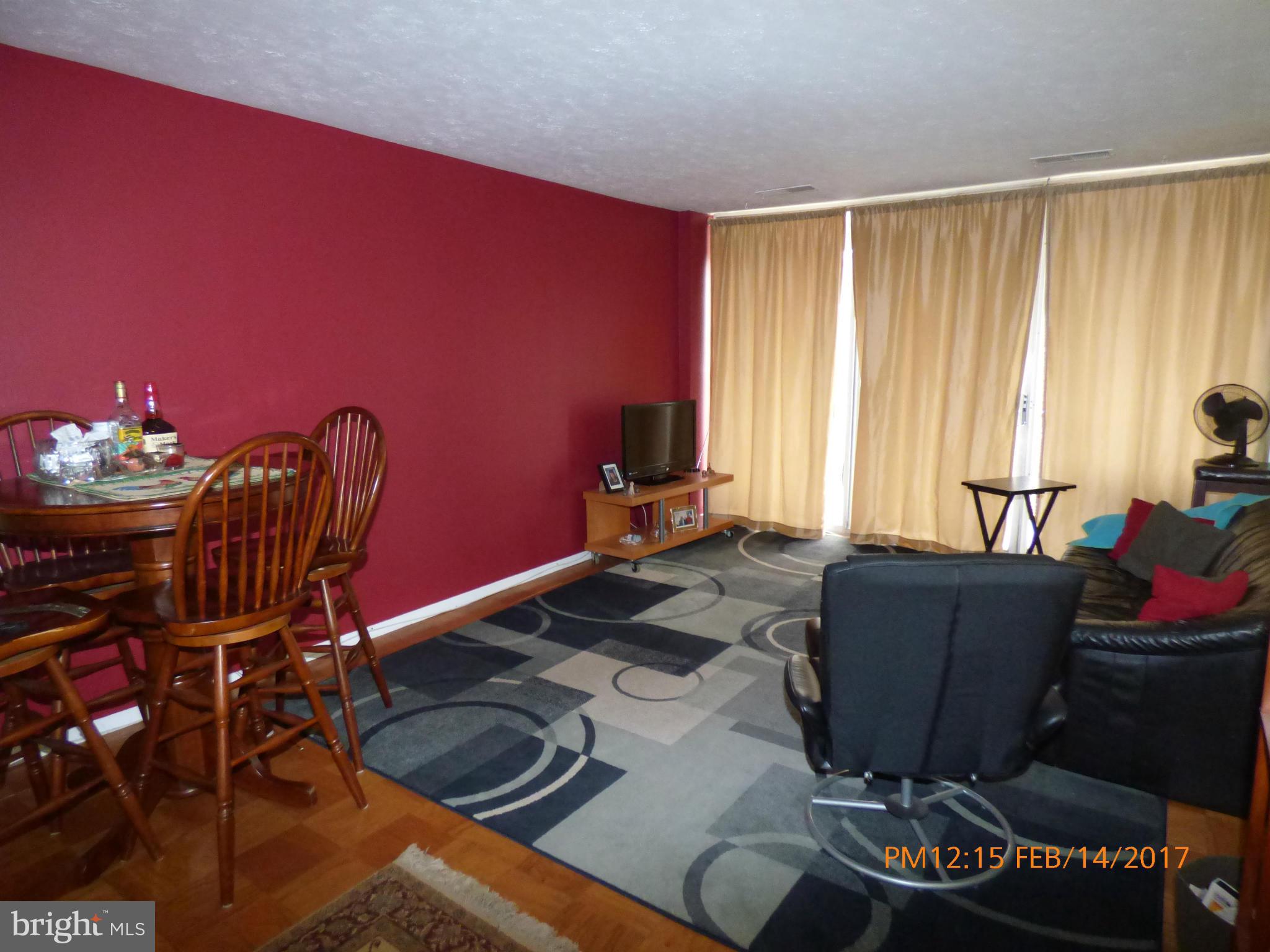 3940 Bel Pre Road, Unit 7 Silver Spring, MD 20906 - Photo 7 of 17 a living room with furniture and a window