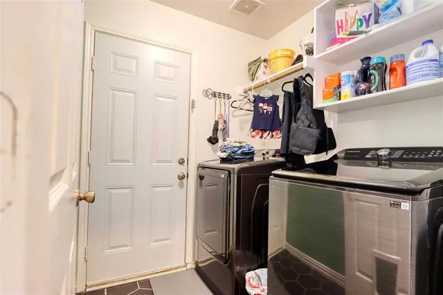 a utility room with dryer and washer
