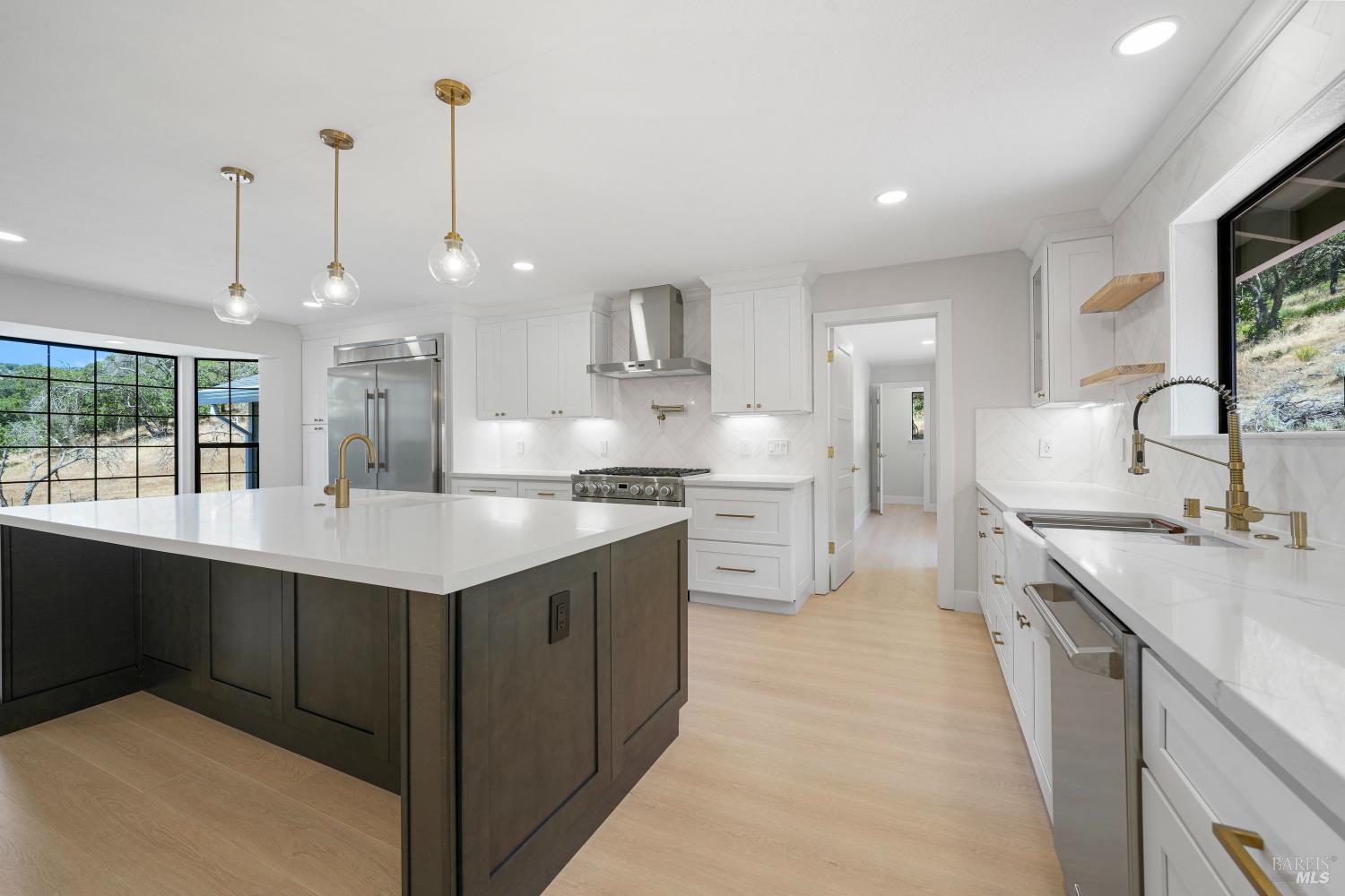 2129 Rockville Road Fairfield, CA 94534 - Photo 1 of 59 a kitchen with kitchen island a sink appliances and cabinets