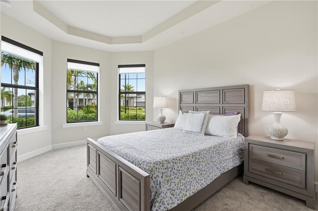 19696 Aqua View Lane Fort Myers, FL 33913 - Photo 21 of 50 a bedroom with a large bed and a window