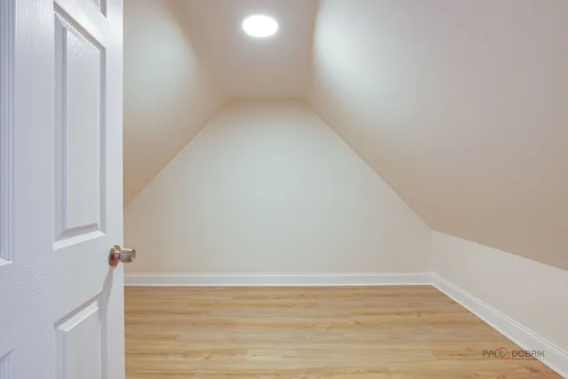 a view of a small space with wooden floor