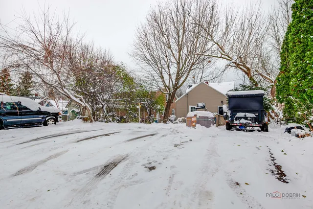 a view of a road with a car parked