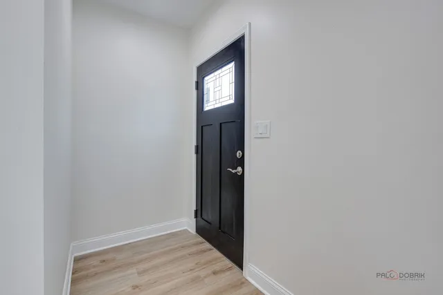 a view of hallway with wooden floor