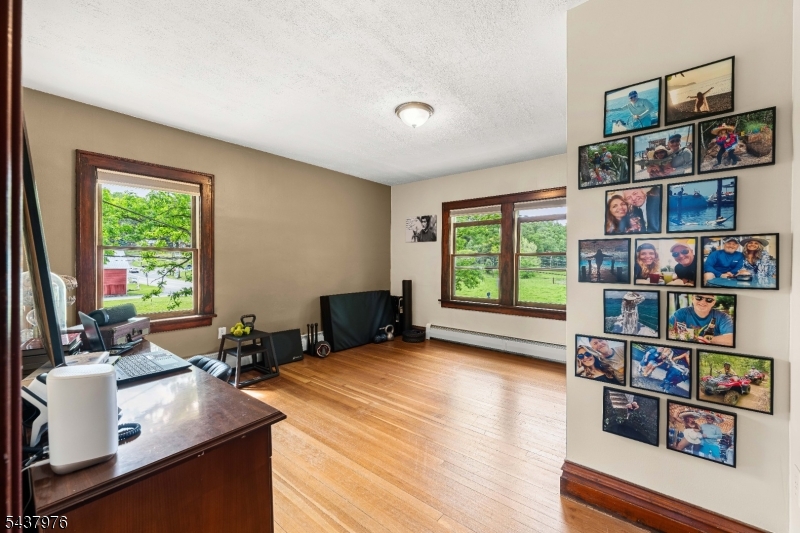 886 Brass Castle Road Belvidere, NJ 07823 - Photo 23 of 44 a room with furniture and a book shelf
