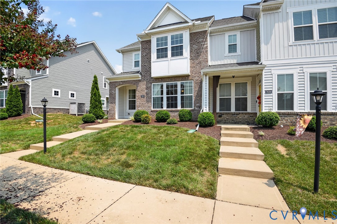 7825 Old Guild Road Richmond, VA 23237 - Photo 2 of 35 Brick and siding exterior featuring white trim, mu
