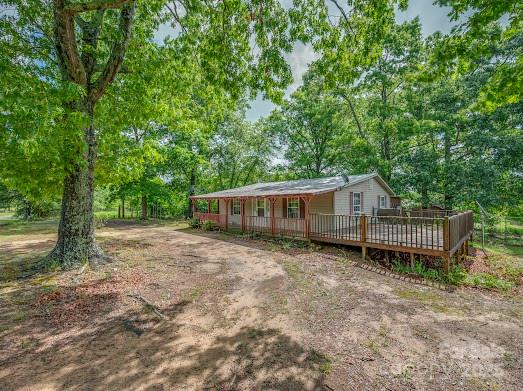 751 Ted Smith Road Rutherfordton, NC 28139 - Photo 1 of 36 a house with trees in the background
