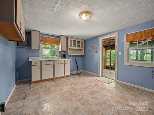 751 Ted Smith Road Rutherfordton, NC 28139 - Photo 23 of 36 a kitchen with a sink stove and cabinets