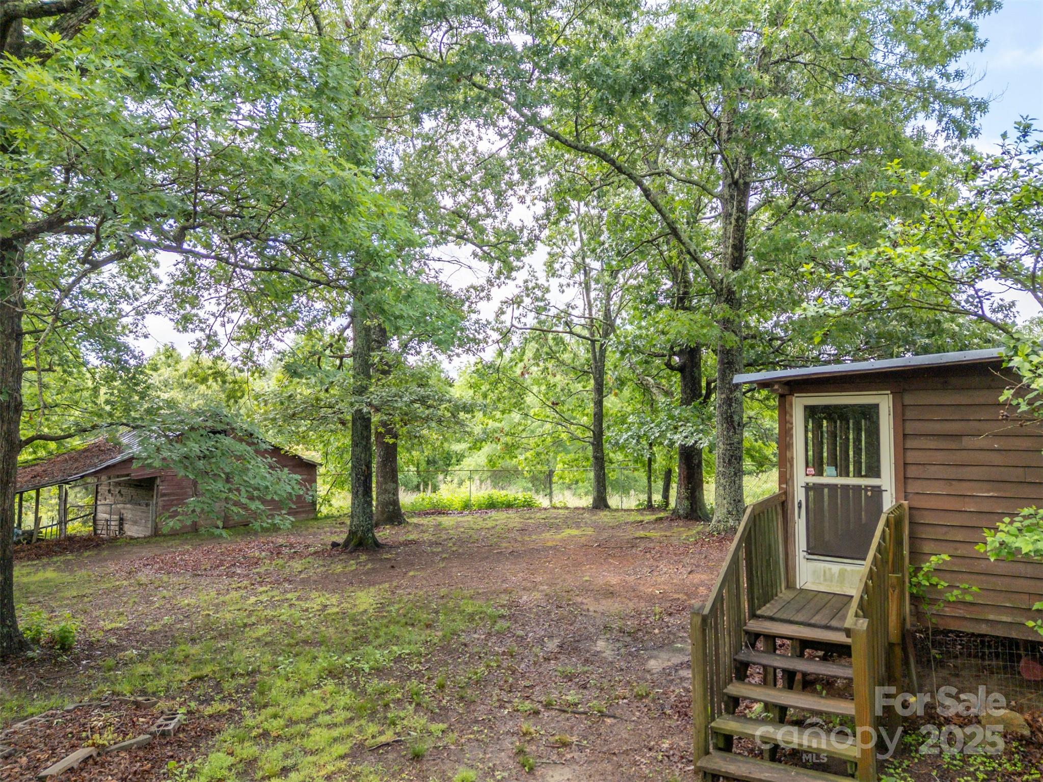 751 Ted Smith Road Rutherfordton, NC 28139 - Photo 29 of 36 a view of a house with backyard and trees