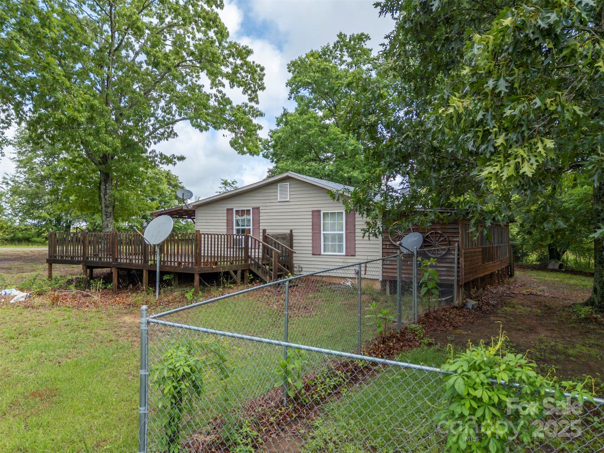 751 Ted Smith Road Rutherfordton, NC 28139 - Photo 10 of 36 a backyard of a house with table and chairs