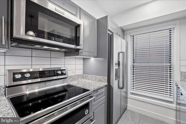 a kitchen with a stove and a microwave