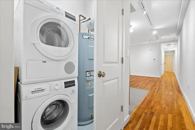 a view of a hallway with washer and dryer