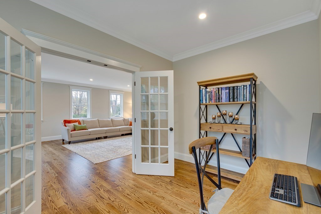 324 Concord Road Bedford, MA 01730 - Photo 11 of 42 a living room with furniture and a wooden floor
