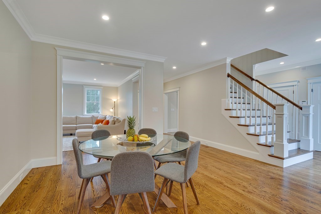 324 Concord Road Bedford, MA 01730 - Photo 15 of 42 a view of a dining room with furniture and wooden floor