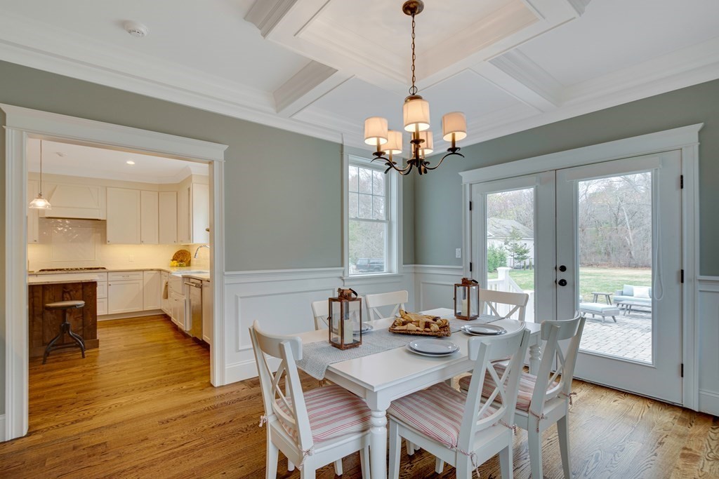 324 Concord Road Bedford, MA 01730 - Photo 21 of 42 a view of a dining room with furniture wooden floor and chandelier