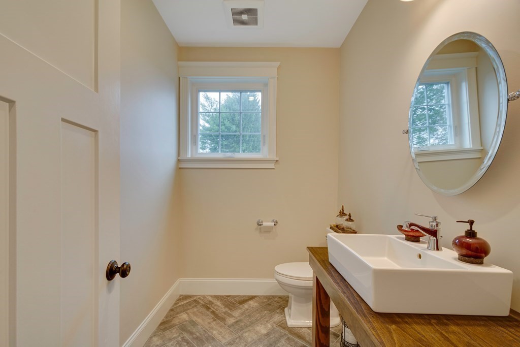 324 Concord Road Bedford, MA 01730 - Photo 24 of 42 a bathroom with a sink and a mirror
