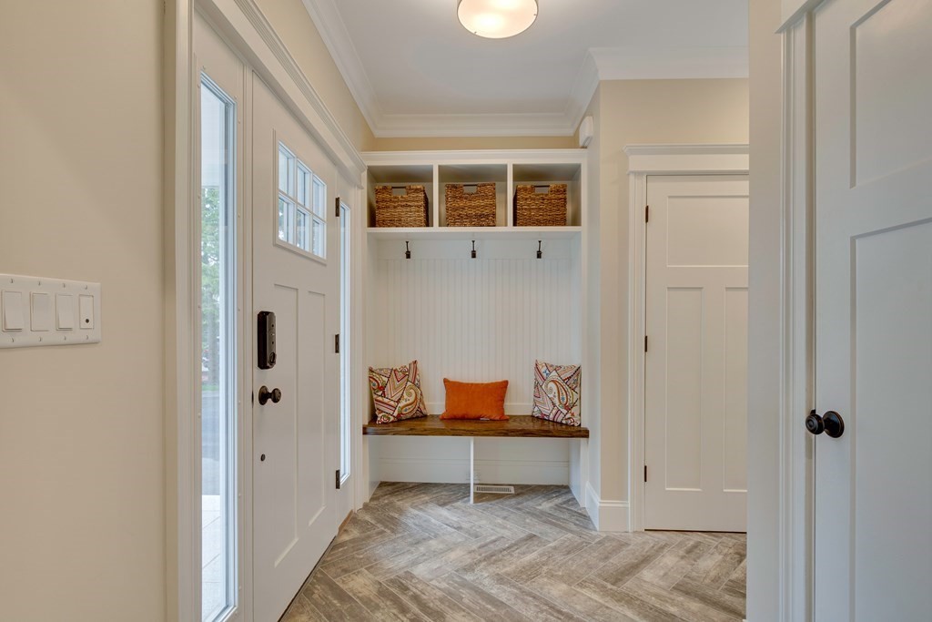 324 Concord Road Bedford, MA 01730 - Photo 3 of 42 a room that has a bed and a chair in it