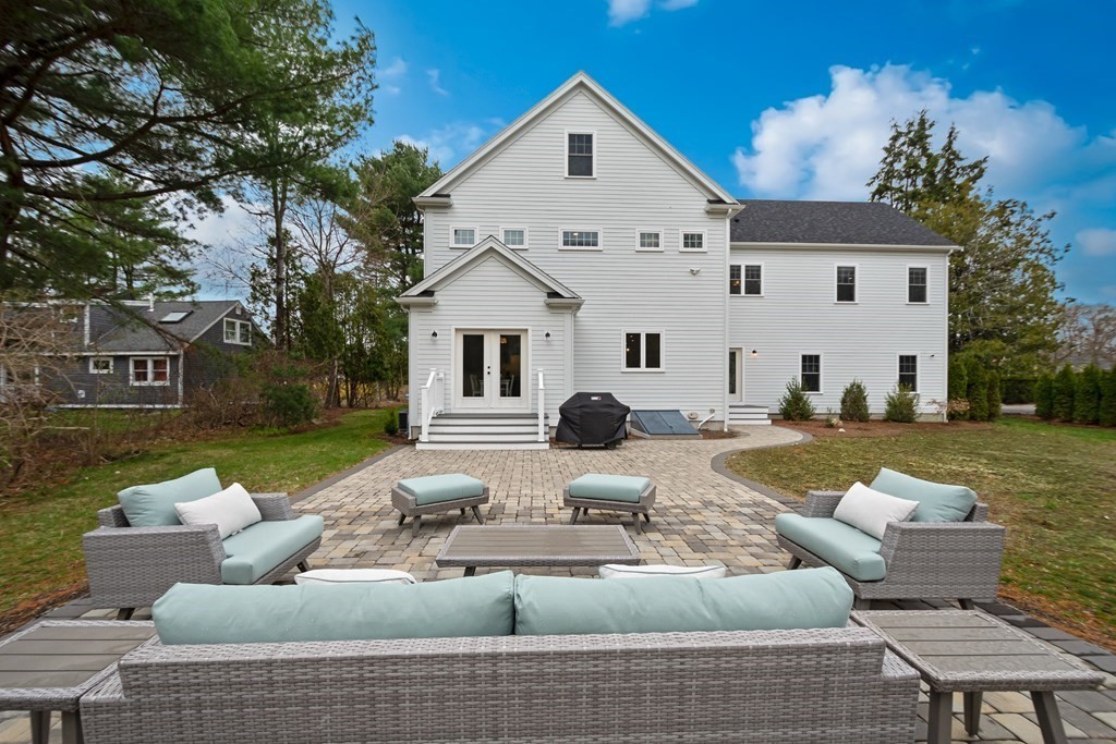 324 Concord Road Bedford, MA 01730 - Photo 40 of 42 a front view of a house with swimming pool having outdoor seating
