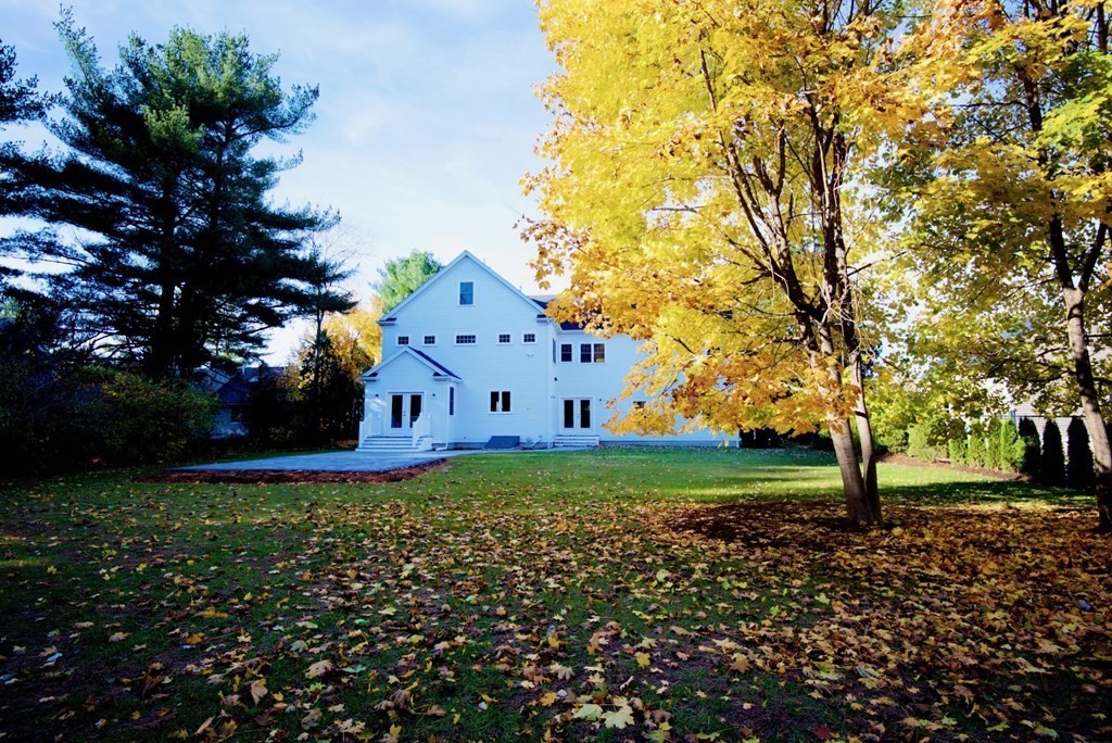324 Concord Road Bedford, MA 01730 - Photo 41 of 42 a front view of a house with garden