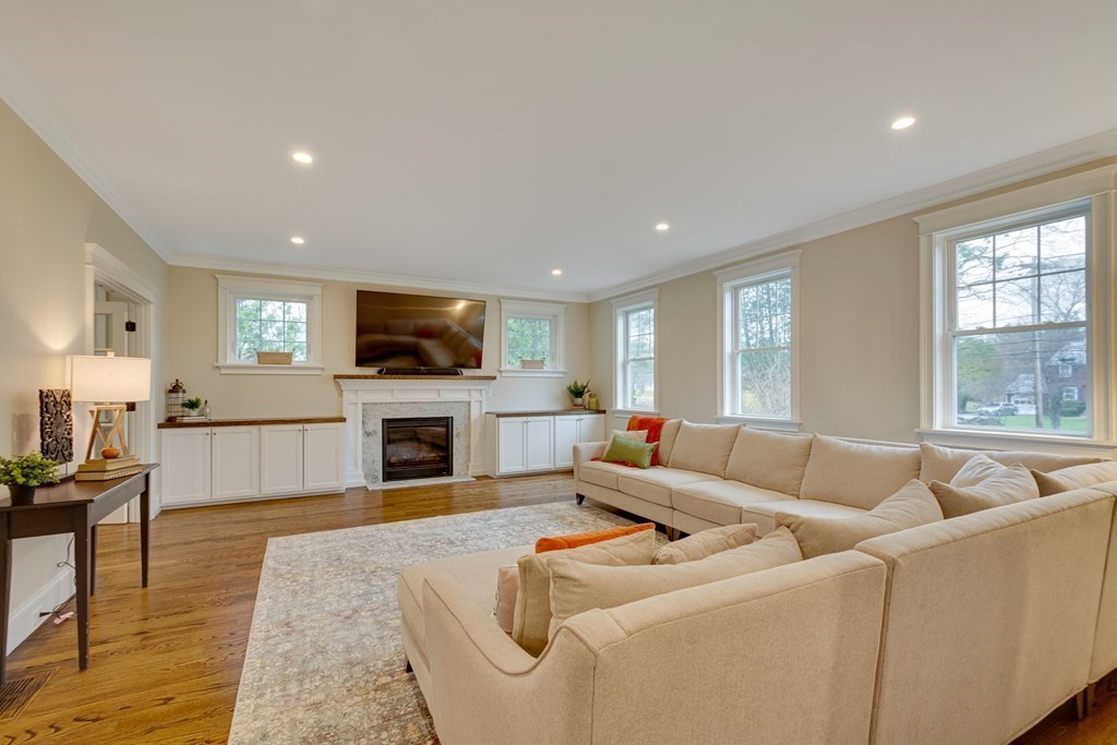 324 Concord Road Bedford, MA 01730 - Photo 5 of 42 a living room with furniture and a flat screen tv