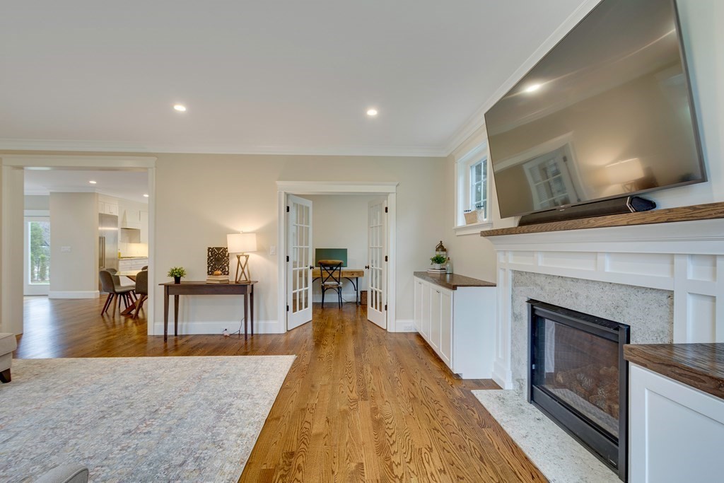 324 Concord Road Bedford, MA 01730 - Photo 7 of 42 a living room with furniture and a fireplace