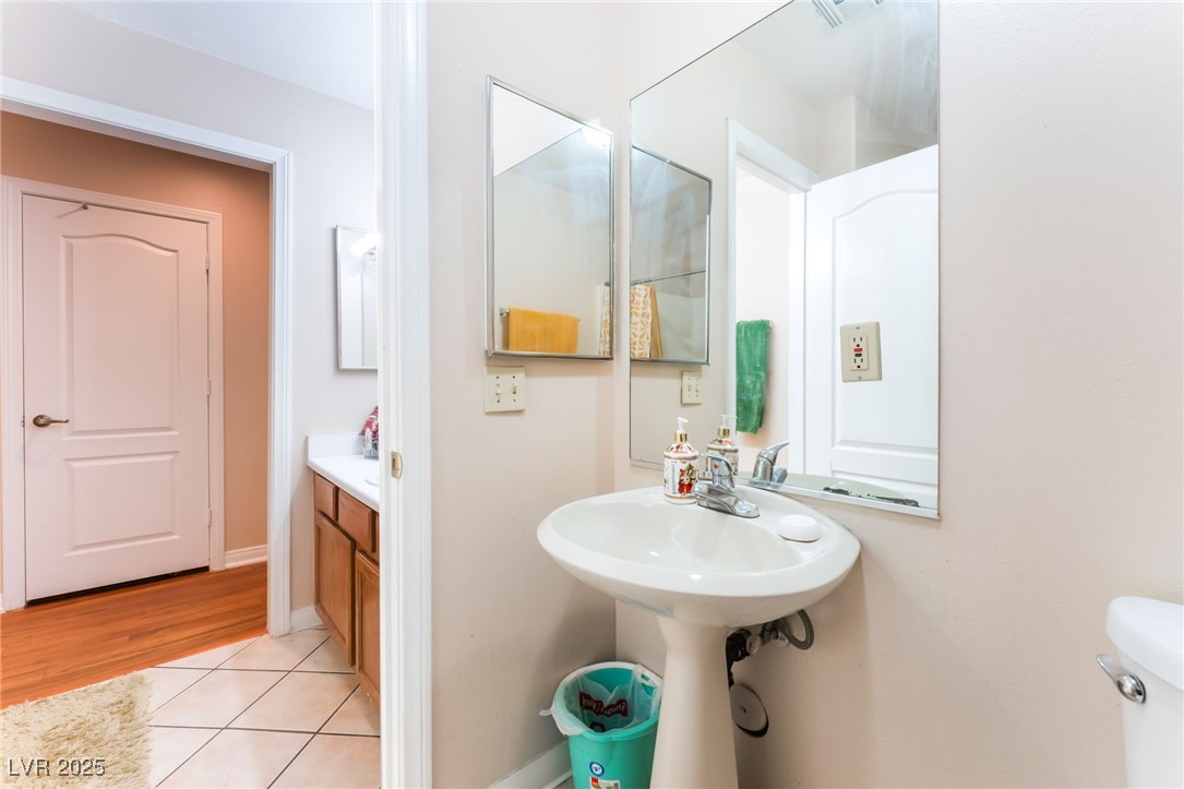 4656 East Desert Inn Road Las Vegas, NV 89121 - Photo 15 of 98 4656 E DI Bathroom with tile patterned floors and toilet