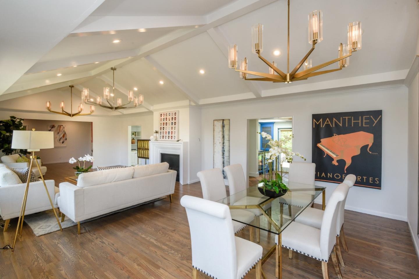 835 Longview Road Hillsborough, CA 94010 - Photo 11 of 46 a living room with furniture a fireplace and a chandelier