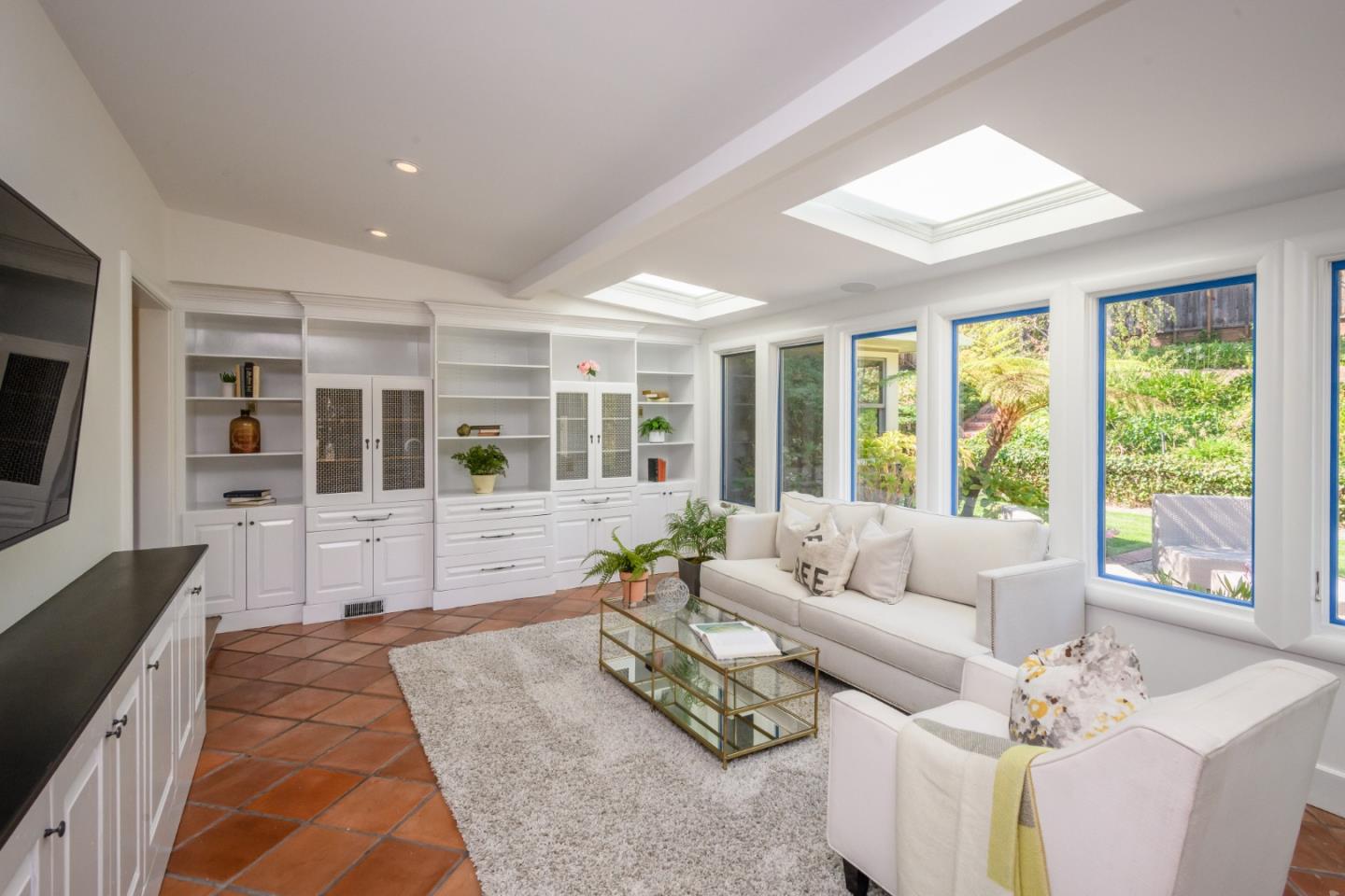 835 Longview Road Hillsborough, CA 94010 - Photo 12 of 46 a living room with furniture large windows large wooden floor and windows