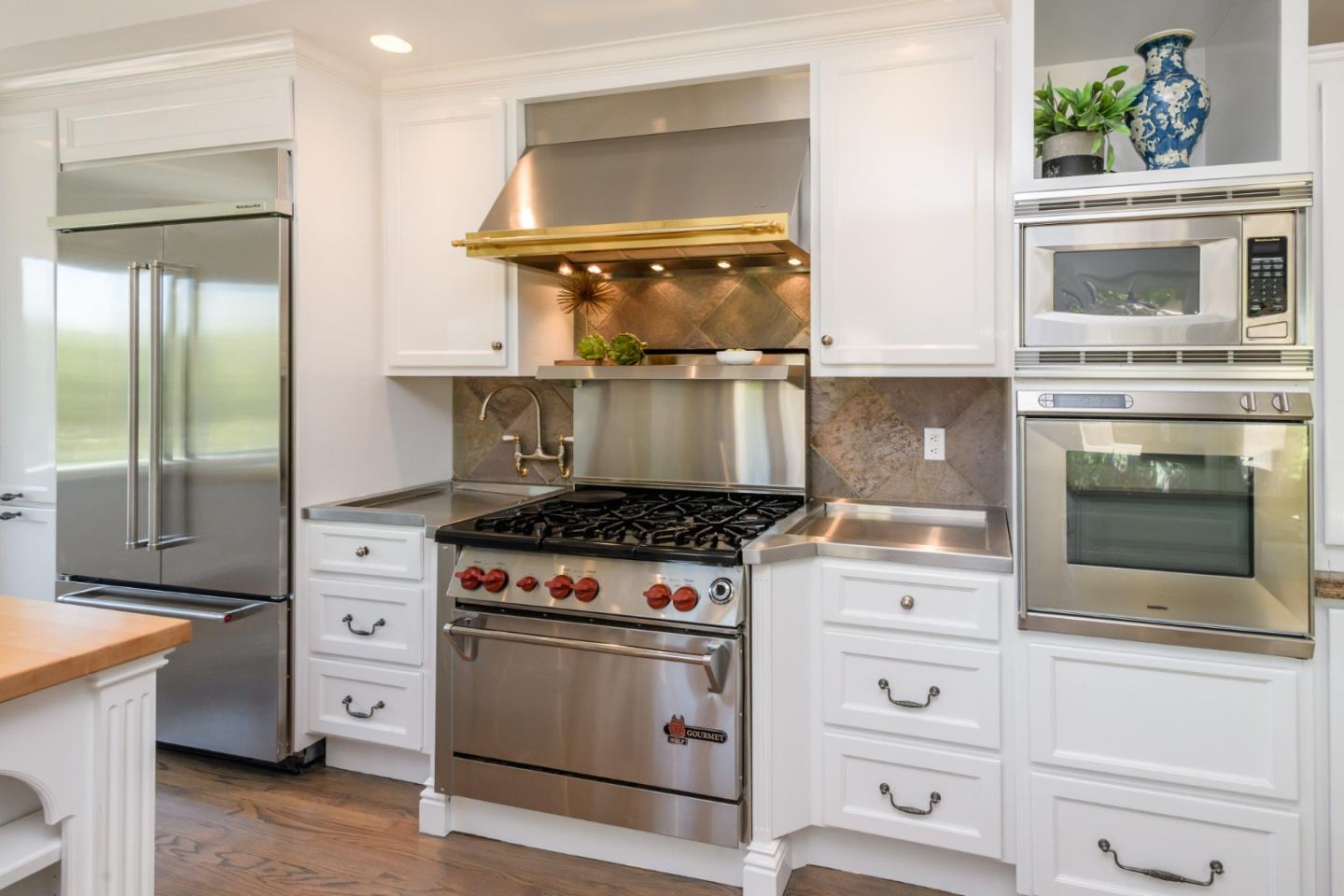 835 Longview Road Hillsborough, CA 94010 - Photo 18 of 46 a stove top oven sitting inside of a kitchen