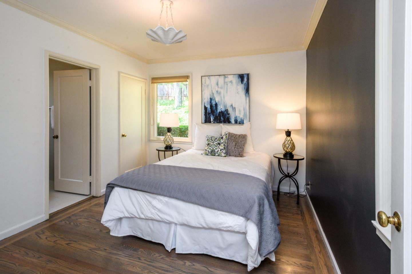 835 Longview Road Hillsborough, CA 94010 - Photo 22 of 46 a bedroom with a bed and a mirror