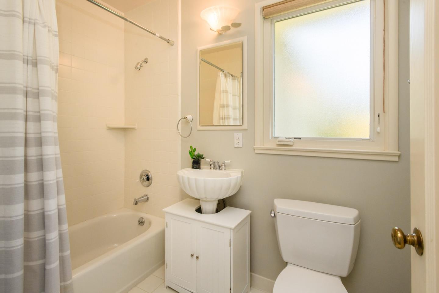 835 Longview Road Hillsborough, CA 94010 - Photo 23 of 46 a bathroom with a sink toilet and shower