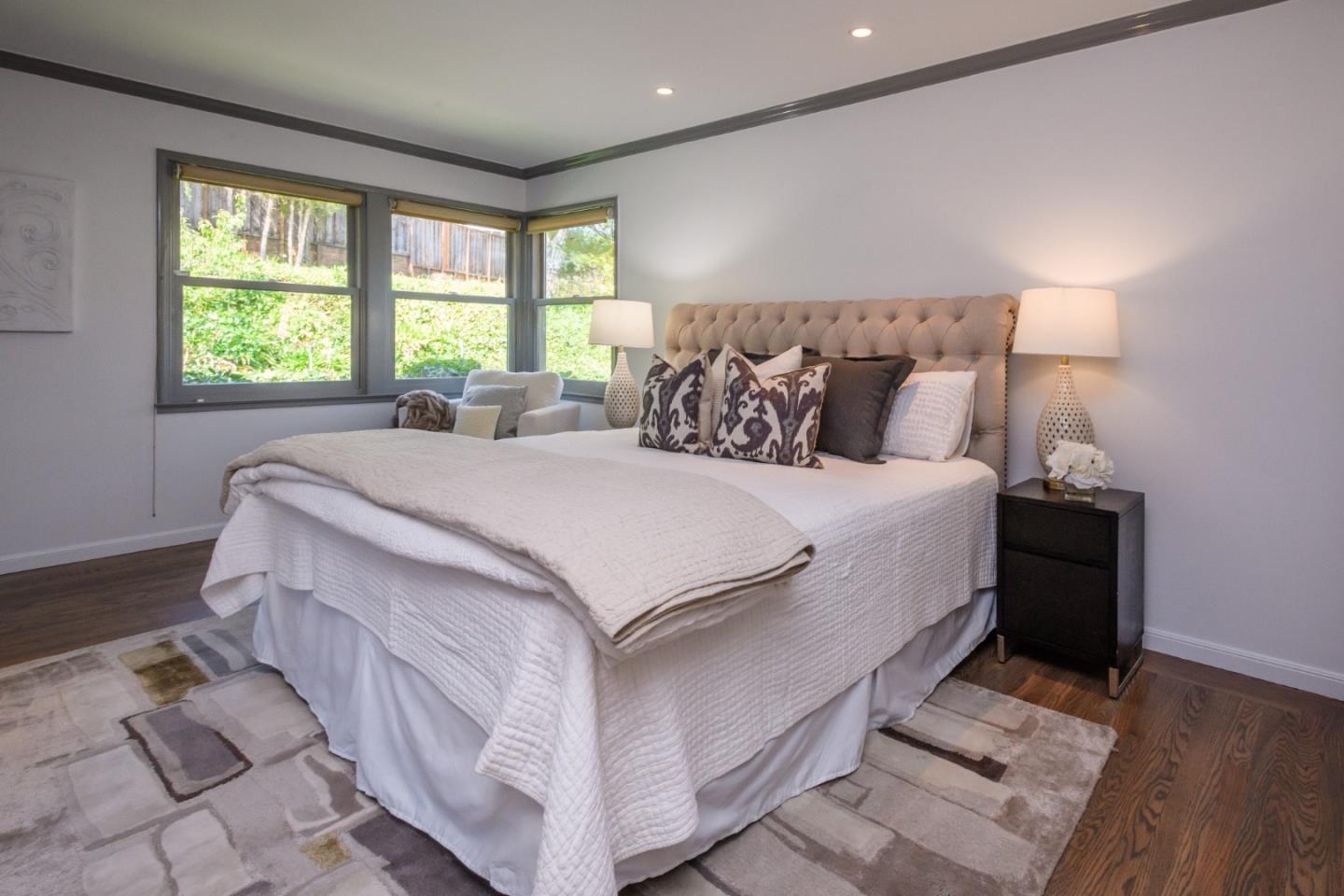 835 Longview Road Hillsborough, CA 94010 - Photo 24 of 46 a large bed sitting in a bedroom next to a window