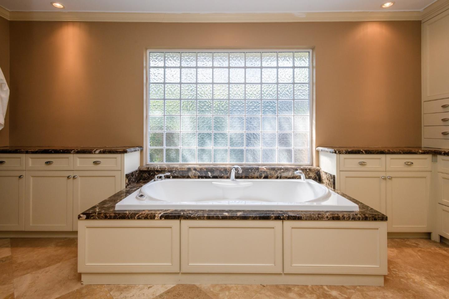 835 Longview Road Hillsborough, CA 94010 - Photo 27 of 46 a bathroom with tub sink and mirror