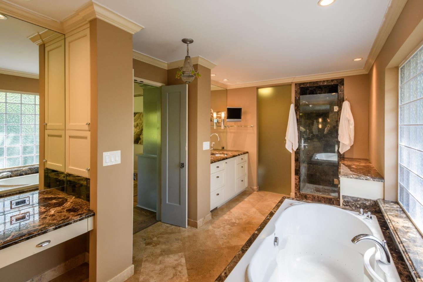 835 Longview Road Hillsborough, CA 94010 - Photo 28 of 46 a bathroom with a granite countertop tub sink and mirror