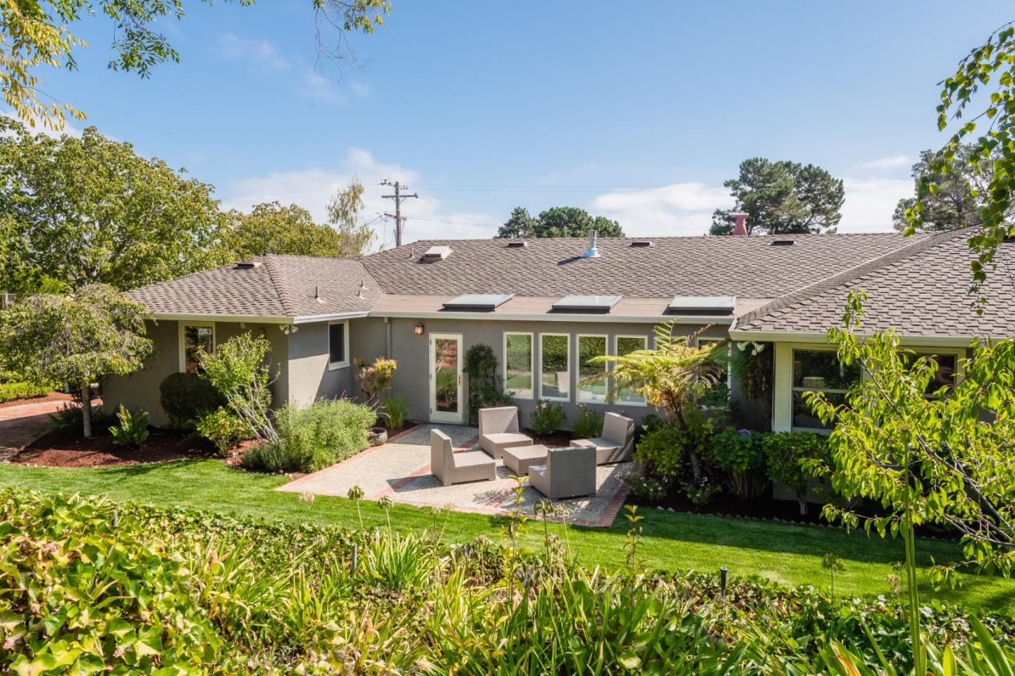 835 Longview Road Hillsborough, CA 94010 - Photo 33 of 46 a view of a patio with table and chairs potted plants