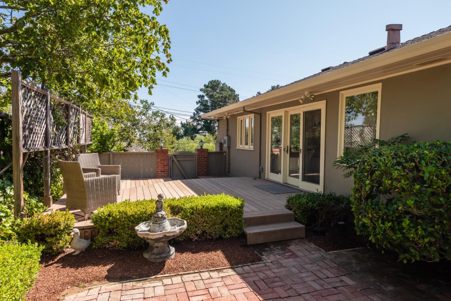 835 Longview Road Hillsborough, CA 94010 - Photo 34 of 46 a view of a backyard with chair and potted plants