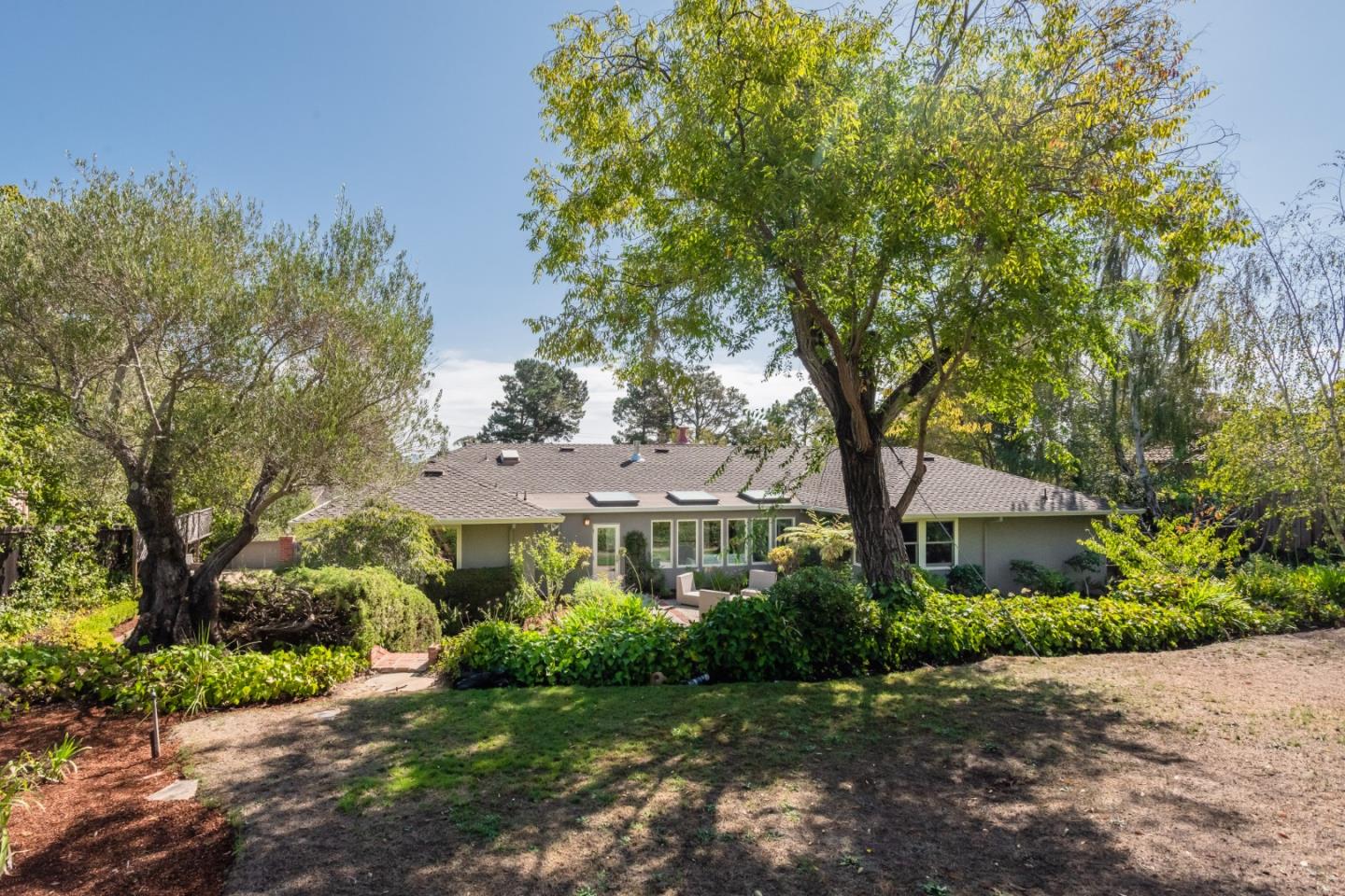 835 Longview Road Hillsborough, CA 94010 - Photo 45 of 46 a front view of a house with a yard and tree s