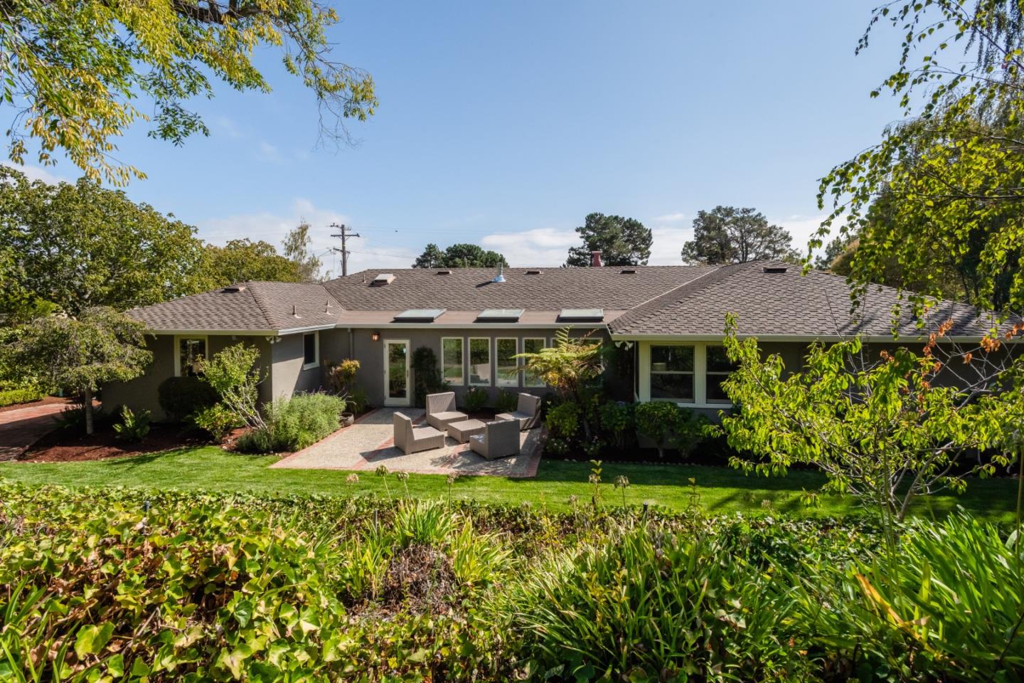 835 Longview Road Hillsborough, CA 94010 - Photo 5 of 46 a front view of a house with garden
