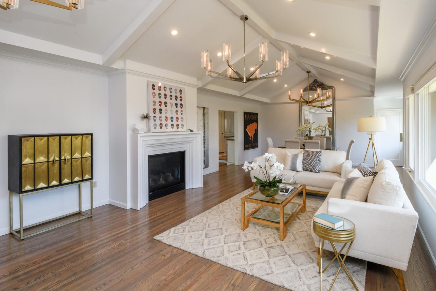 835 Longview Road Hillsborough, CA 94010 - Photo 9 of 46 a living room with furniture a fireplace and a flat screen tv