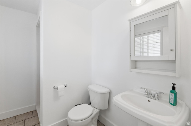 353 Robin Street Smithfield, UT 84335 - Photo 27 of 70 Half bathroom with toilet and light tile patterned flooring