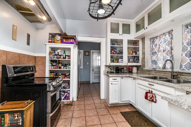 a kitchen with stainless steel appliances a stove and a refrigerator