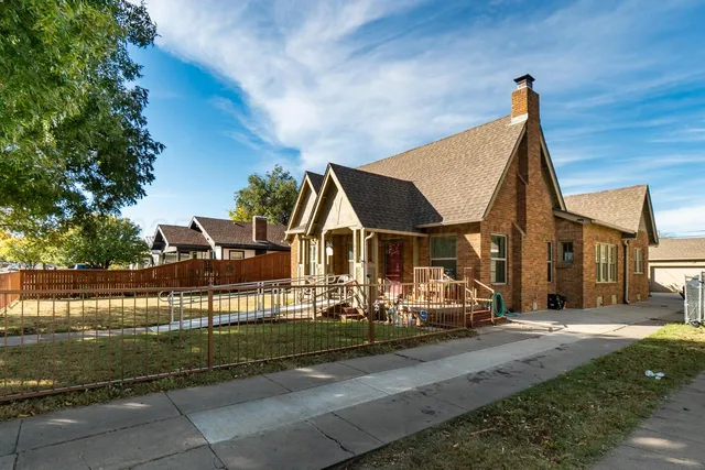 a view of house with outdoor space and sitting area