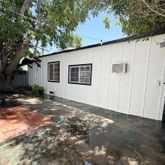 a view of a backyard of the house