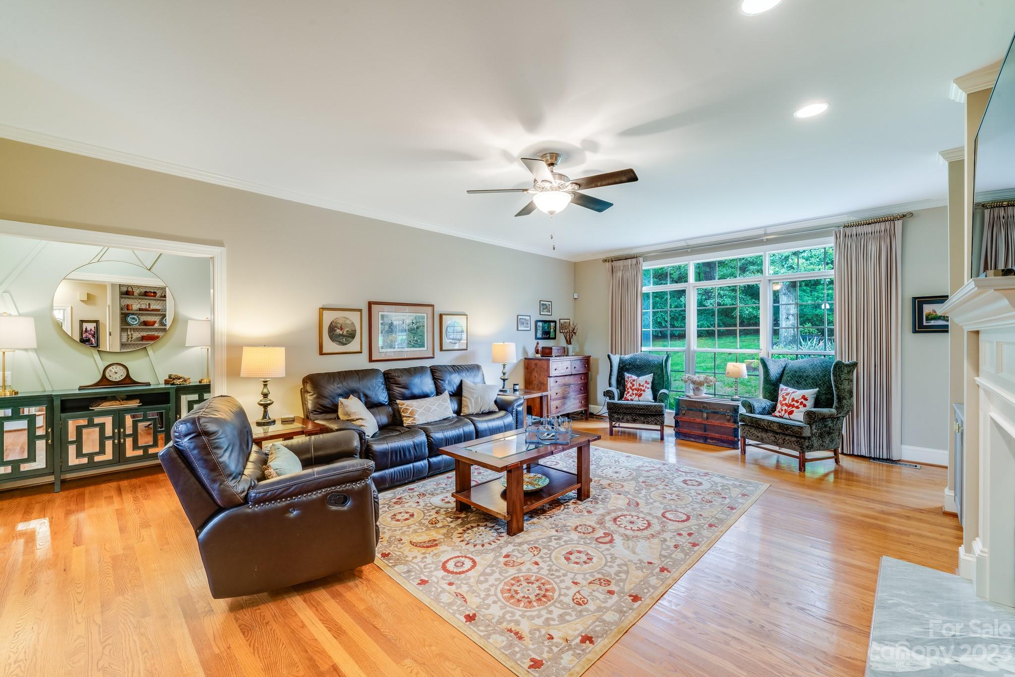 123 Lake Pointe Drive Fort Mill, SC 29708 - Photo 12 of 46 a living room with furniture and a wooden floor