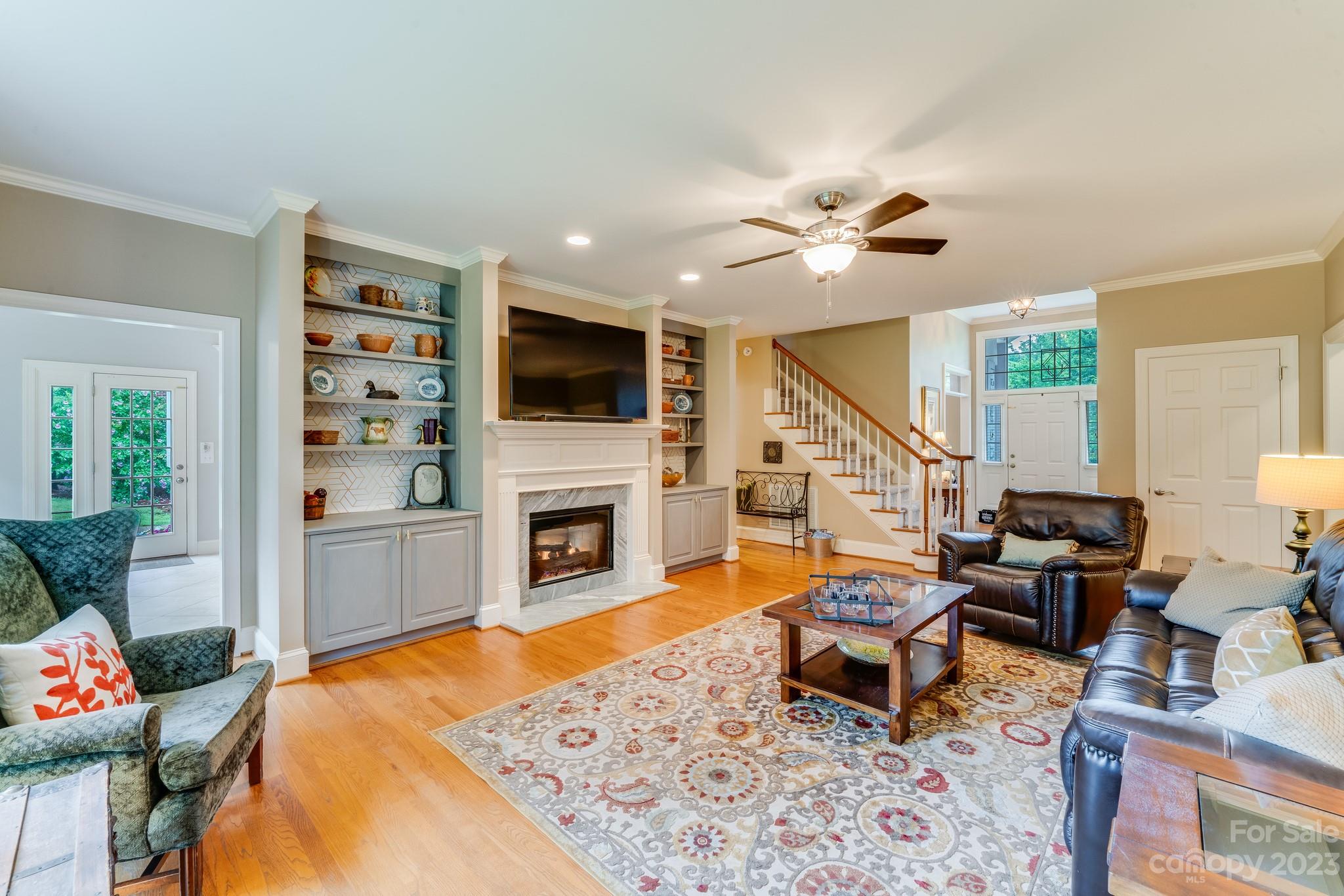123 Lake Pointe Drive Fort Mill, SC 29708 - Photo 13 of 46 a living room with furniture and a fireplace