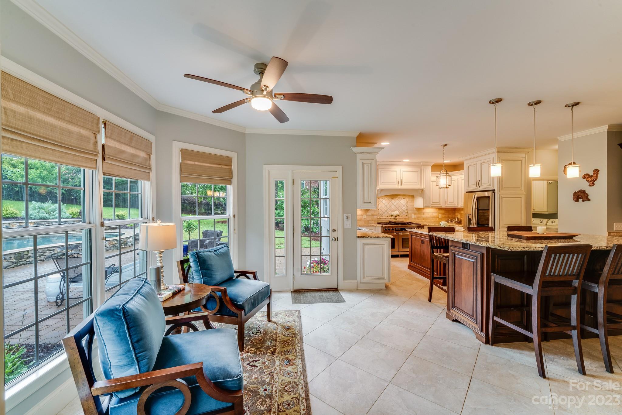 123 Lake Pointe Drive Fort Mill, SC 29708 - Photo 15 of 46 a living room with furniture a flat screen tv and a large window