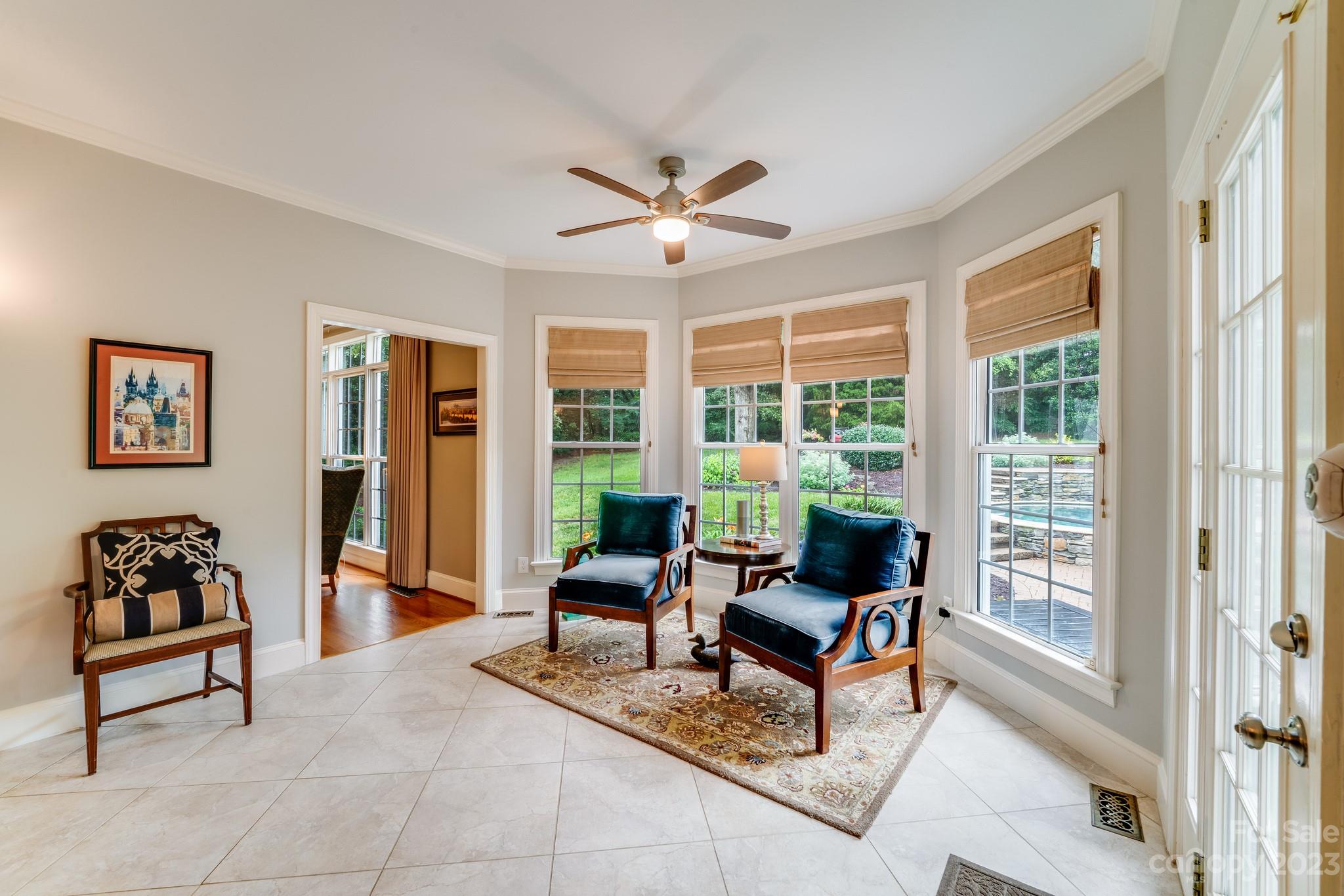 123 Lake Pointe Drive Fort Mill, SC 29708 - Photo 16 of 46 a living room with furniture and floor to ceiling windows